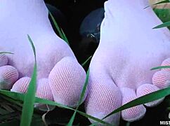 goddess feet in cute white socks on spring grass field