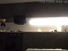 amateur woman fingers her pussy while cooking in the kitchen.