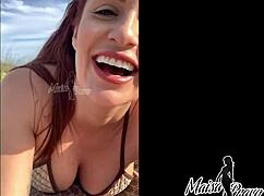 Redhead wife gives blowjob and gets fucked doggystyle on beach