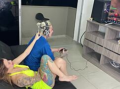 gamer stepbrother plays while chatting casually