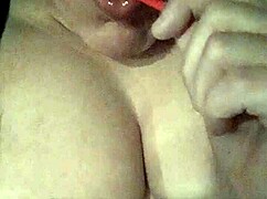 Moaning While Sucking Lollipop And Playing With Tits