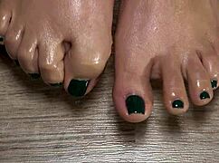 Close-Up View Of Green-Nailed Toes For Your Fetish
