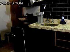 Giving a quick lick and foreplay to her swollen pussy before the party in the kitchen.