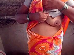 Housewife shows her big boobs in the village house