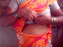 Housewife shows her big boobs in the village house