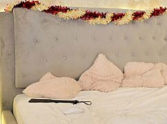 A student playfully spanks her ass before undressing in a solo session.