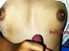 Viral Indonesian amateur cumshot on niece's small natural tits during homemade handjob session.
