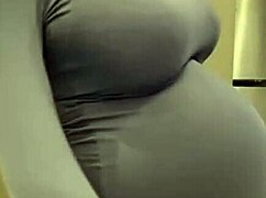 the pregnant stepmother slowly reveals her milky tits from the red bra in the quiet room