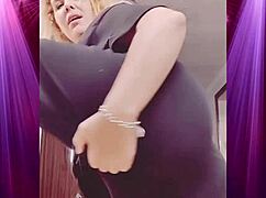 Intensely shaking booty in boyfriend's clothes during dominant dance.