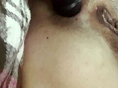 She thrusts the anal plug with vibrations