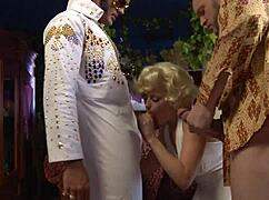 i'm in this elvis parody threesome, sucking and fucking with two guys.