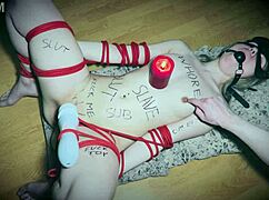 Bound Slave With Vibrator As Candlestick