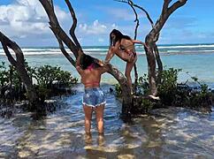 Two gorgeous girls enjoying the beach at enseada dos corais in cabo, pe, with kissing and outdoor fun.