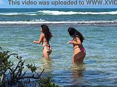 Two gorgeous girls enjoying the beach at enseada dos corais in cabo, pe, with kissing and outdoor fun.