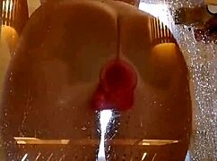Is this girl with an appetizing ass having fun in the shower with a pink dick?