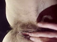 A teacher takes a break to masturbate her hairy wet pussy.