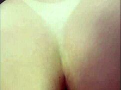 She sits and deeply inserts a huge toy, crazy with desire, craving double penetration.