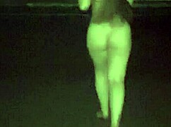 A girl in micro panties relaxes on the beach