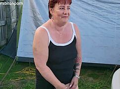 filthy kiwi mature milf pisses on the ground at the campground while campers are around