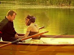 A beautiful girl with small 18+ tits rode a strong man on a boat