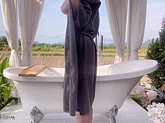 Amateur Asian student takes a relaxing bath in a public rice field outdoors with friends