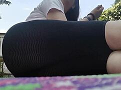 nicoletta embraces nature with dirty feet in public garden yoga