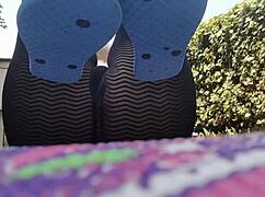 nicoletta embraces nature with dirty feet in public garden yoga