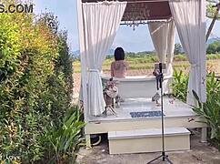 Amateur Asian student takes a relaxing bath in a public rice field outdoors with friends