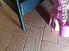 sitting on a chair in pantyhose and high heeled boots