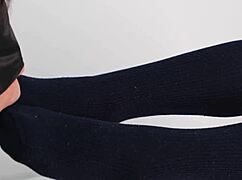 Asian babe in uniform gives footjob with navy socks, dominating slave with beautiful legs