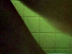 she's pleasuring herself with a huge dildo insertion at home.