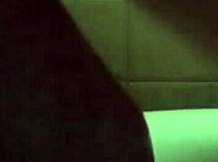 she's pleasuring herself with a huge dildo insertion at home.