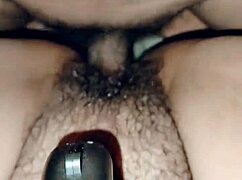 mature woman casually masturbates with her dildo in a relaxed home setting