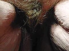 oma inserts cucumber into her hairy pussy for some fun