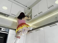 hottest redhead cheerleader shows see through panties in kitchen