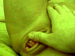 Brunette in white swimsuit teases with real tits, masturbating wet pussy for pleasure