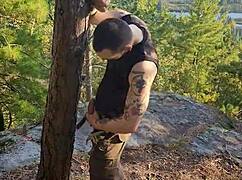 Hairy Tattooed Man Masturbating Outdoors in Forest