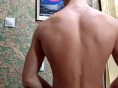 Skinny Boy Flexes Muscles After Study Session