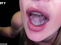 Two girls share sixteen cumshots in gloryhole action