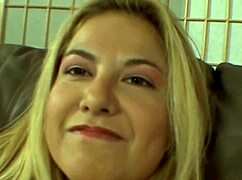 Busty blonde reveals wet shaved pussy and natural big tits