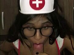 Latina nurse checks young patient