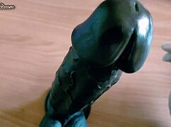 teasing handjob on huge black dildo using sexy gloves