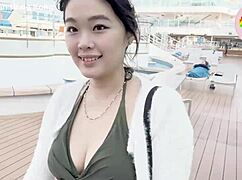 Macy Chan seduces in Hong Kong cruise twilight, blending sexy daily life with erotic Cantonese AV vibes by the pool