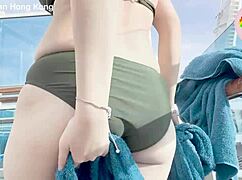 Macy Chan seduces in Hong Kong cruise twilight, blending sexy daily life with erotic Cantonese AV vibes by the pool