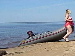 Wow, juicy ass milf struts beach in big natural tits glory!