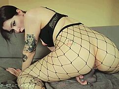 pretty brunette in fishnets rides huge dildo tight ass to cam