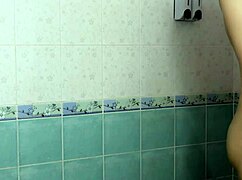 thai schoolgirl secretly filmed showering her shaved pussy and tight body