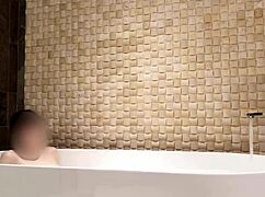 cute skinny japanese brunette bathes in luxury hotel shower