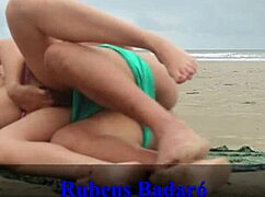 Brunette latina couple disguised as beachgoers fucks bent over doggystyle on sandy shore