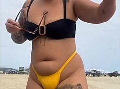 tight yellow bikini splits swollen pussy on crowded beach